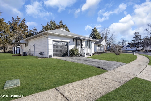 ranch-style home with a front lawn, central AC unit, and a garage