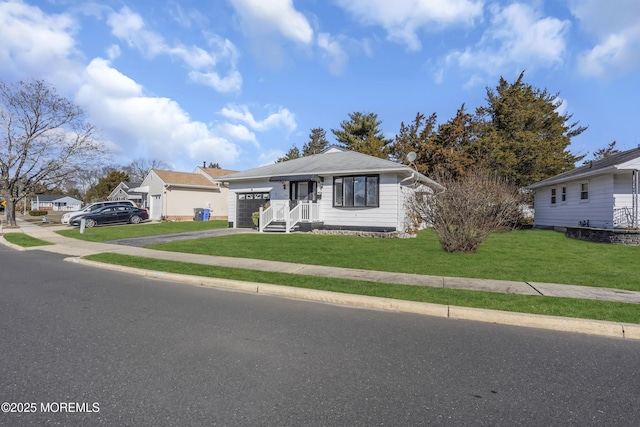 ranch-style house featuring a front lawn and a garage