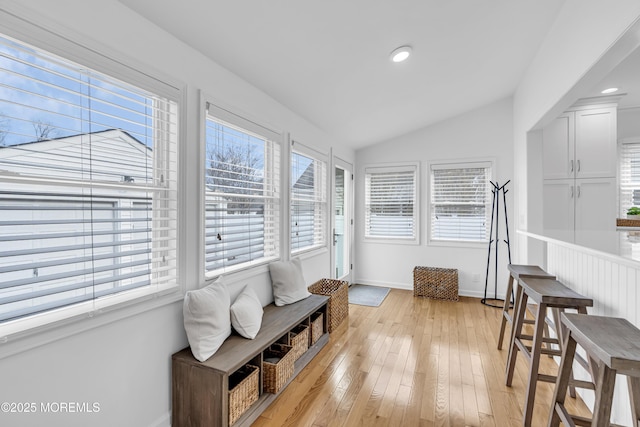 sunroom / solarium with vaulted ceiling