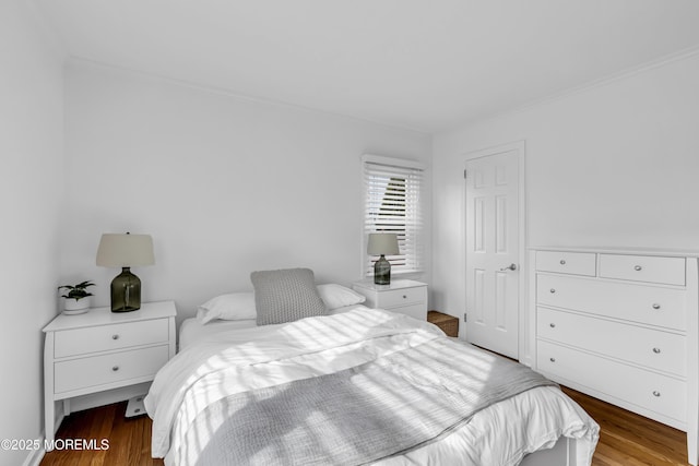 bedroom with hardwood / wood-style flooring