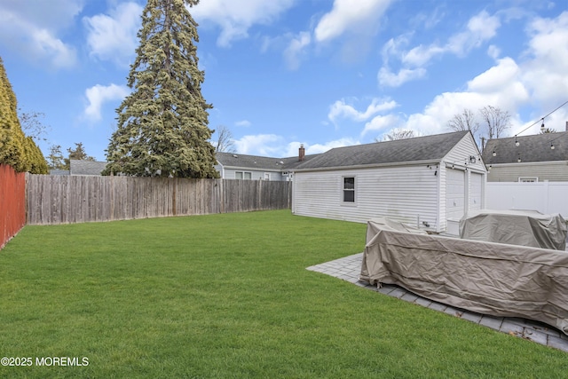 view of yard with an outdoor structure and a garage