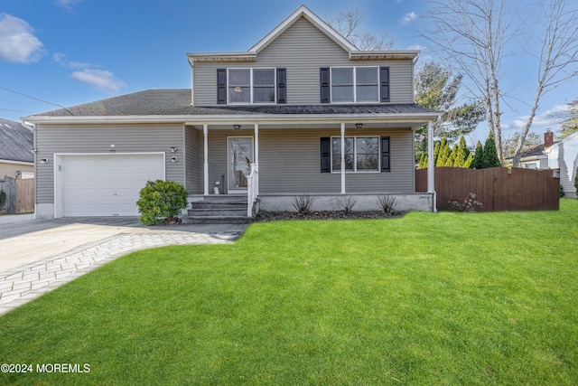 front facade with a front yard, covered porch, and a garage