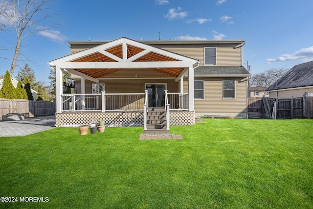 rear view of house with a lawn