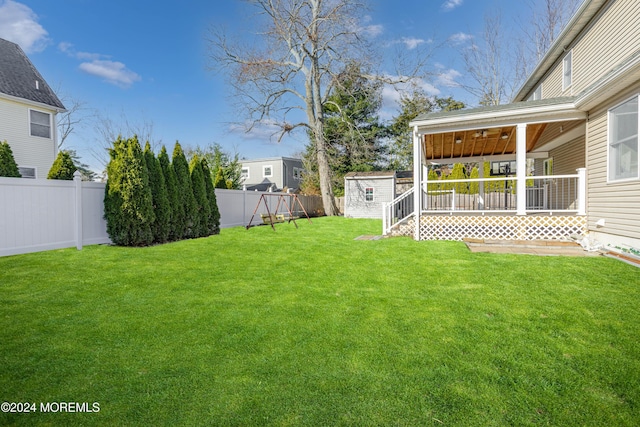 view of yard featuring a storage unit