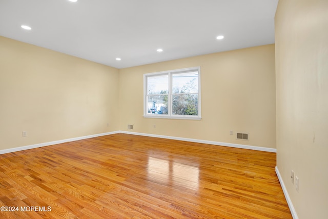 unfurnished room featuring light hardwood / wood-style flooring