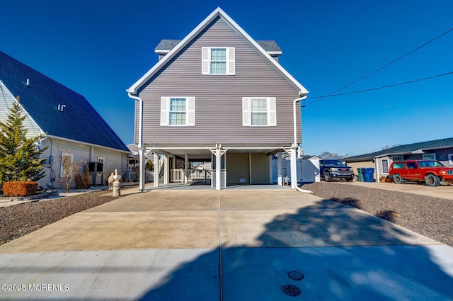 view of front of home with a carport