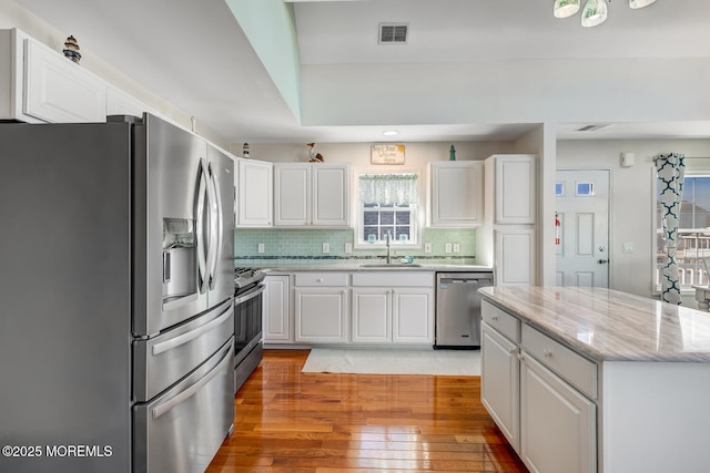 kitchen featuring appliances with stainless steel finishes and white cabinets