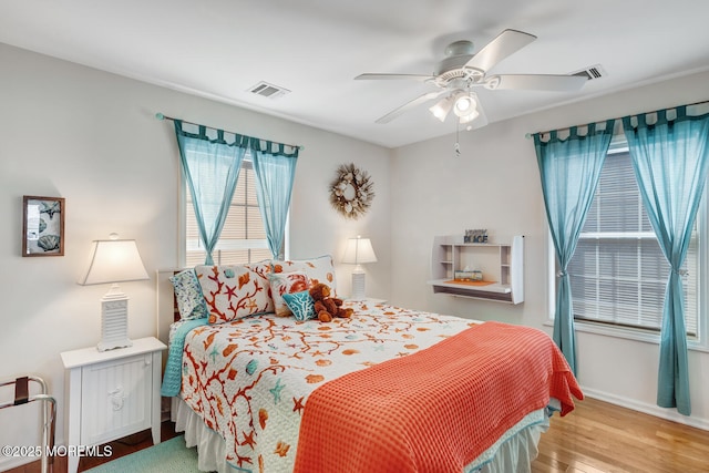 bedroom with ceiling fan and light wood-type flooring