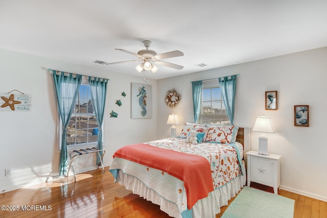 bedroom with wood-type flooring and ceiling fan