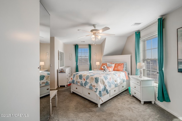 bedroom with lofted ceiling, ceiling fan, and light colored carpet