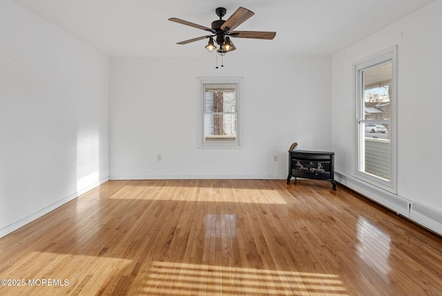 unfurnished room with ceiling fan and light hardwood / wood-style floors