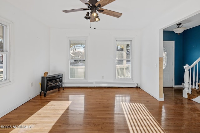 unfurnished room with hardwood / wood-style floors and ceiling fan