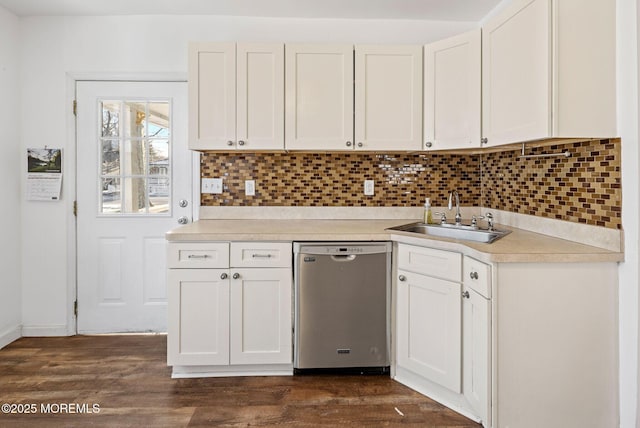 kitchen featuring sink, backsplash, white cabinets, and dishwasher