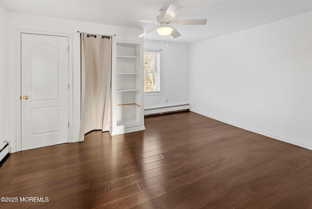 unfurnished bedroom with ceiling fan, baseboard heating, and dark hardwood / wood-style floors