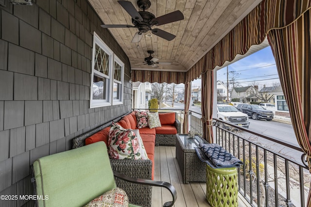 exterior space with an outdoor hangout area, ceiling fan, and covered porch