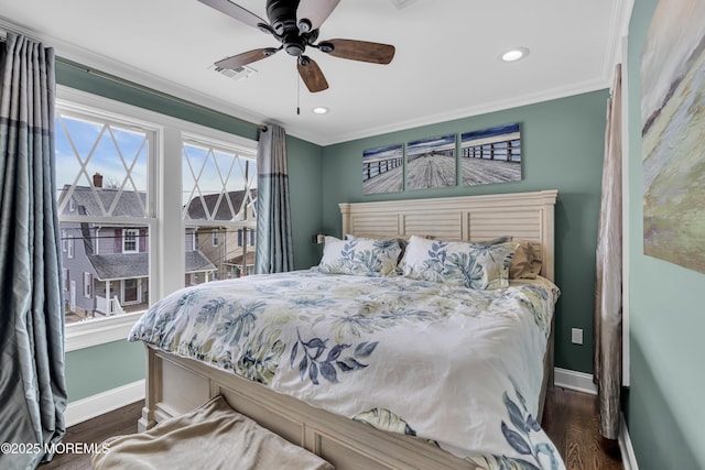 bedroom featuring ceiling fan, crown molding, and dark hardwood / wood-style floors