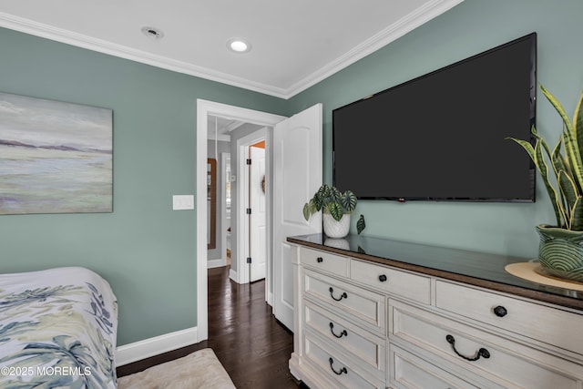 bedroom with dark hardwood / wood-style flooring and crown molding