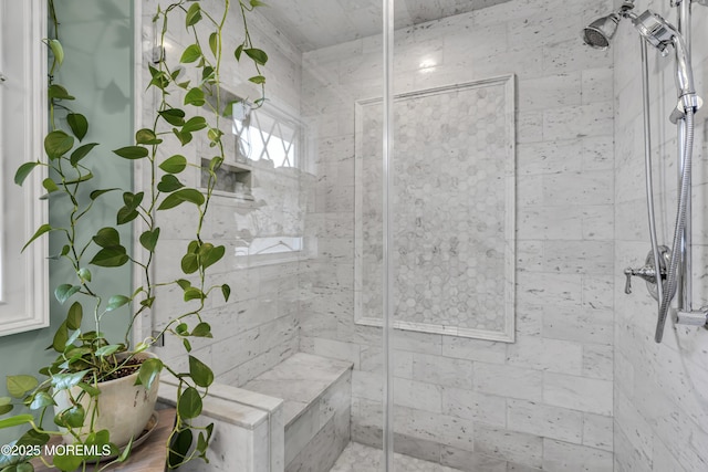 bathroom featuring tiled shower