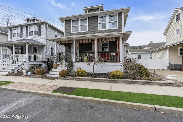 view of front of property with central AC unit and covered porch