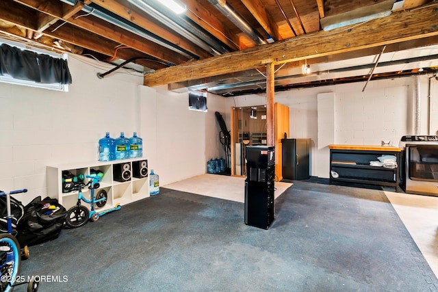 unfinished basement with washer / clothes dryer