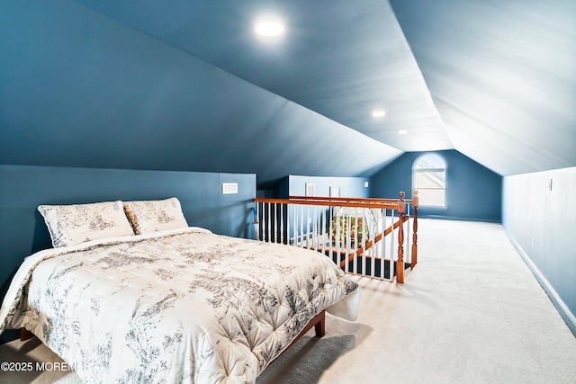 bedroom featuring carpet floors, baseboards, and vaulted ceiling