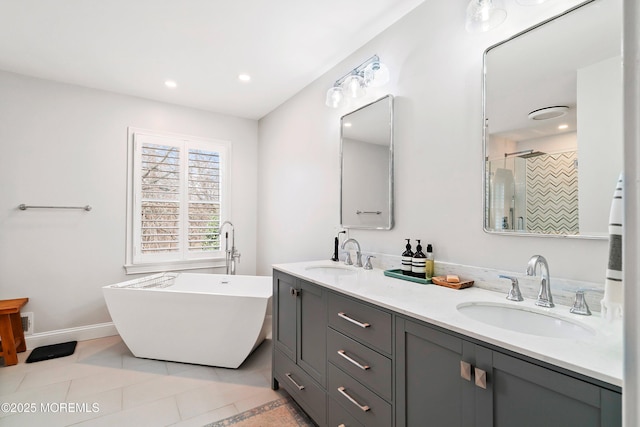 bathroom with recessed lighting, tile patterned flooring, a sink, and a shower stall