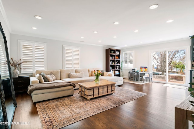 living area featuring crown molding, wood finished floors, and recessed lighting