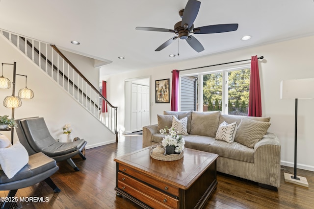 living room with ceiling fan and dark hardwood / wood-style floors