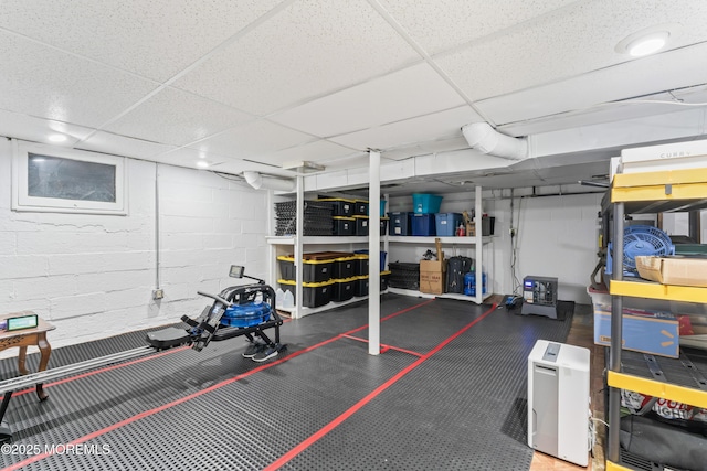 exercise area featuring a drop ceiling