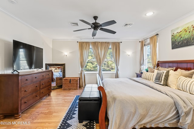 bedroom with ceiling fan, crown molding, light hardwood / wood-style flooring, and multiple windows