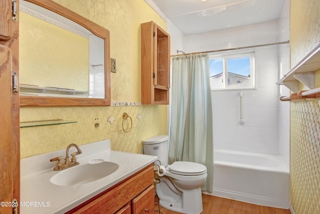 full bathroom with shower / tub combo, hardwood / wood-style floors, vanity, and toilet