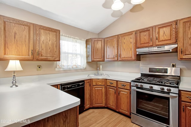 kitchen with sink, vaulted ceiling, black dishwasher, light hardwood / wood-style floors, and stainless steel gas range oven