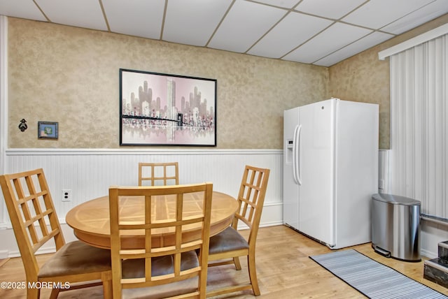 dining area with light hardwood / wood-style floors