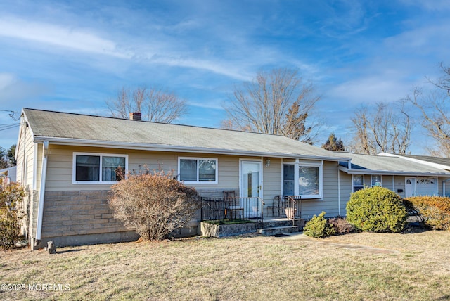 ranch-style home with a front yard