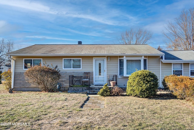 ranch-style house featuring a front lawn