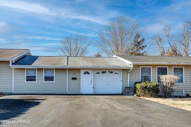 ranch-style home featuring a garage