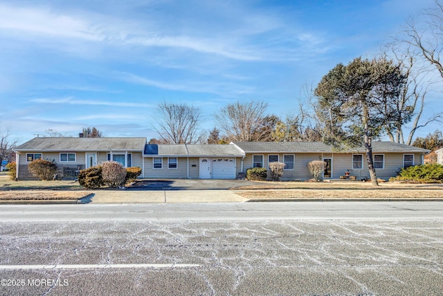 ranch-style house featuring a garage