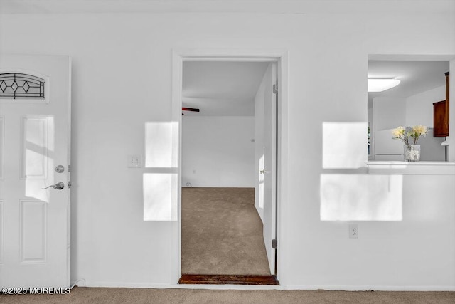 interior space with ceiling fan