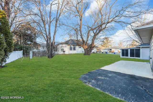 view of yard with a patio and a sunroom