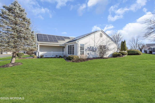 exterior space with a lawn and solar panels