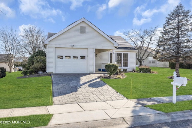 single story home with a front lawn and a garage