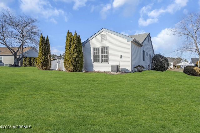 view of home's exterior featuring a yard