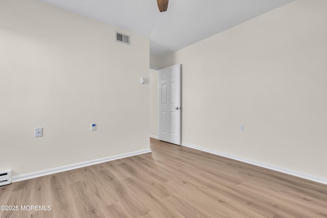 unfurnished room featuring light wood-type flooring and ceiling fan