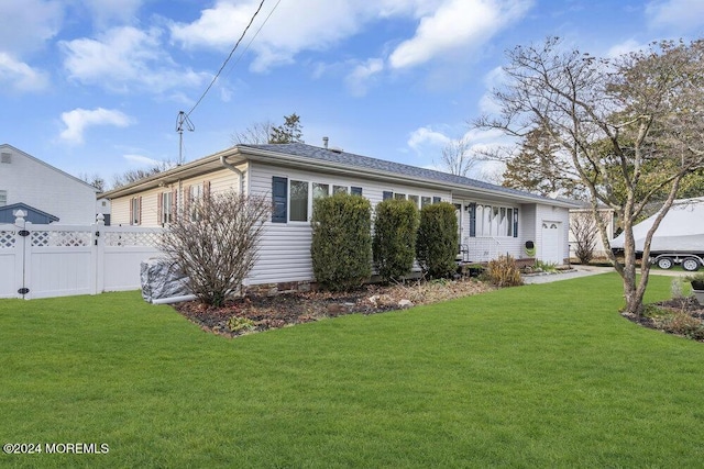 rear view of property with a lawn