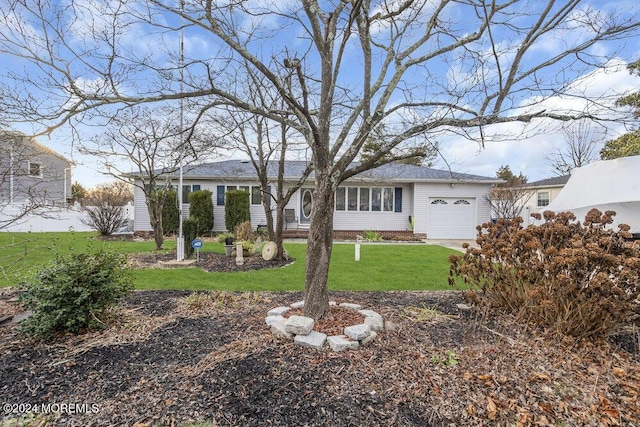 exterior space with a garage and a front yard