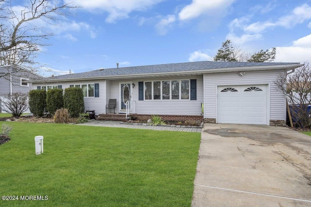 ranch-style home with a front lawn and a garage