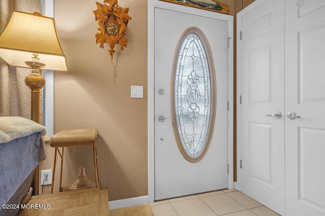 entrance foyer with light tile patterned floors