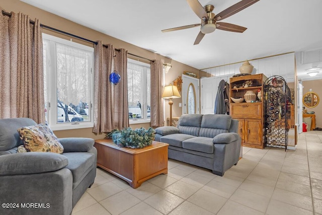 tiled living room with ceiling fan