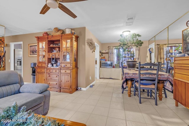 dining room featuring ceiling fan and light tile patterned floors