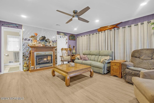 living room with light wood-type flooring and ceiling fan